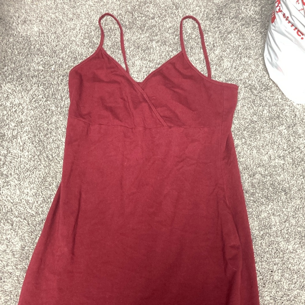 a mid length maroon v cut with spaghetti straps